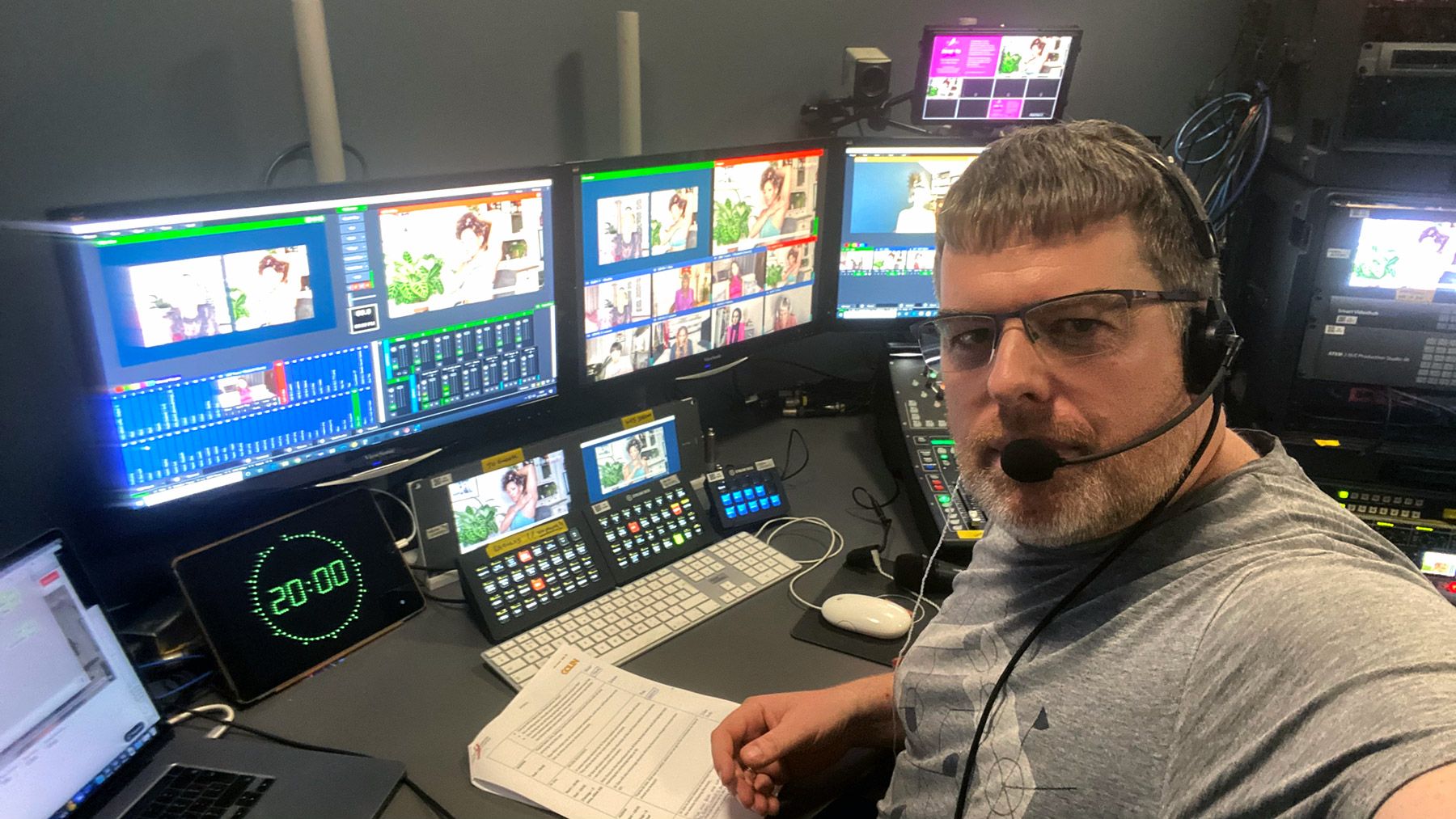 Man takes selfie in front of computer screens