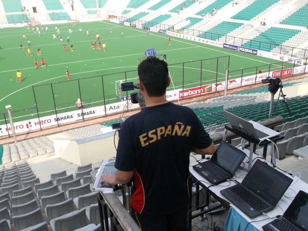 A man is filming a soccer match