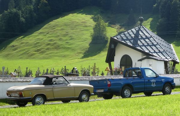 two cars in the summer landscape